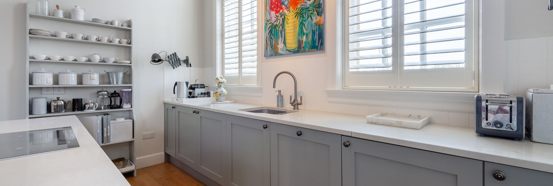 Modern kitchen with bright coloured painting